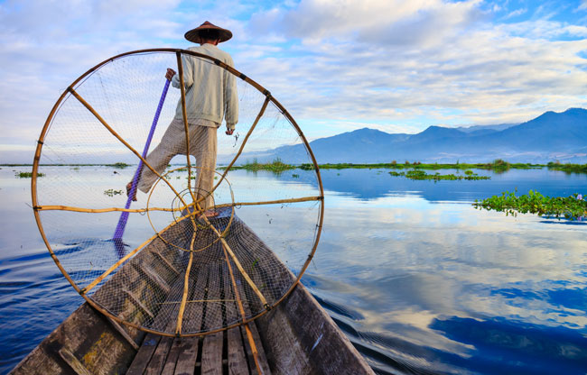 Fishermen in Inle Lake at sunrise, Shan State, Myanmar.