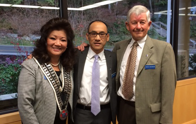 Skål International Vancouver President Lydia Miller with new member Peter Lee and Angus Wilkinson.