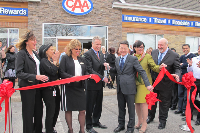 Taking part in the reopening ceremony for CAA Burlington are (left to right): Kathy Kelly, Director; Connie Macchione-Chauvet, Project Manager; Karen Vothknecht, Store Manager; Mayor Rick Goldring; Jay Woo, President and CEO; Ethel Taylor, Board Member; and Carlos Coutinho, COO.