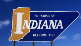 People of Indiana welcome you road sign