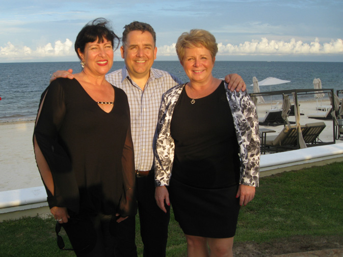 From left, TTAND’s Penny Martin, vice-president of agent experience; Flemming Friisdahl, founder; and Rhonda Stanley, vice-president of talent development, at a farewell party on the Venado Terrace at the Moon Palace Golf & Spa Resort.