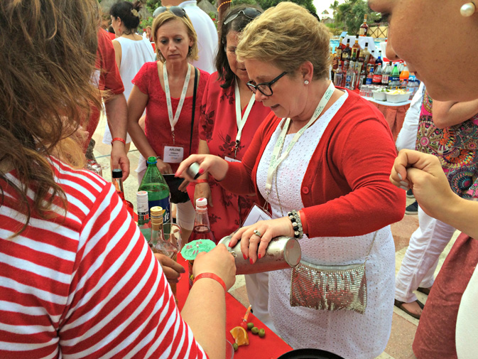 Rhonda Stanley, vice-president of talent development with TTAND, takes part in the cocktail competition, where teams have about 10 minutes to create their own elaborate concoctions.