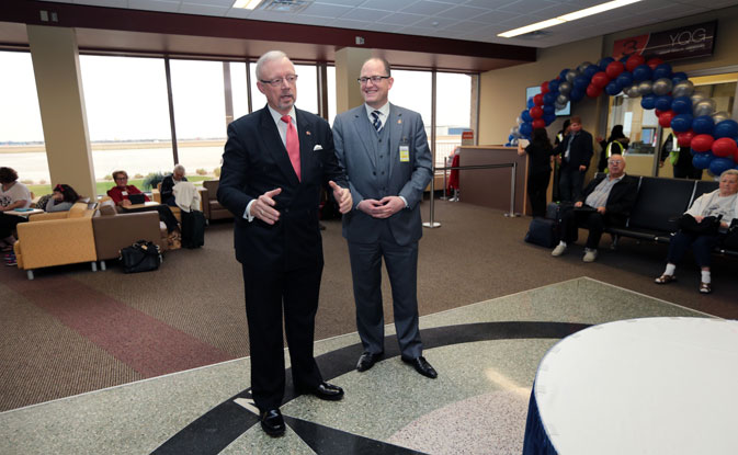 National Airlines President and COO Edward Davidson (left) officiates airport ceremonies celebrating National Airlines’ inaugural passenger flight from Ontario's Windsor International Airport (YQG) to Orlando Sanford International Airport (SFB), alongside Windsor Mayor Drew Dilkens.