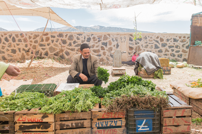 A local farmer sells his wares at a market near Timahdite