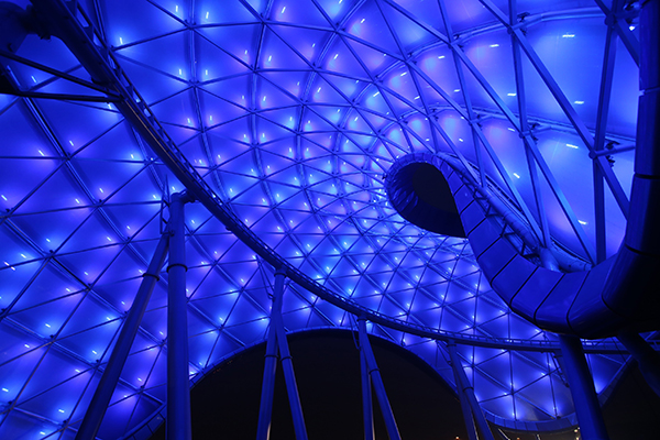 In Tomorrowland, the massive, color-shifting canopy over the TRON Lightcycle Power Run is already being lit up at night while testing continues on the attraction’s exciting new ride vehicles.