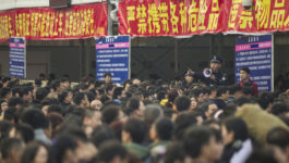 An estimated 100,000 travellers stuck at Chinese train station