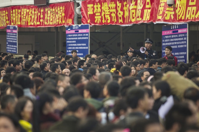An estimated 100,000 travellers stuck at Chinese train station