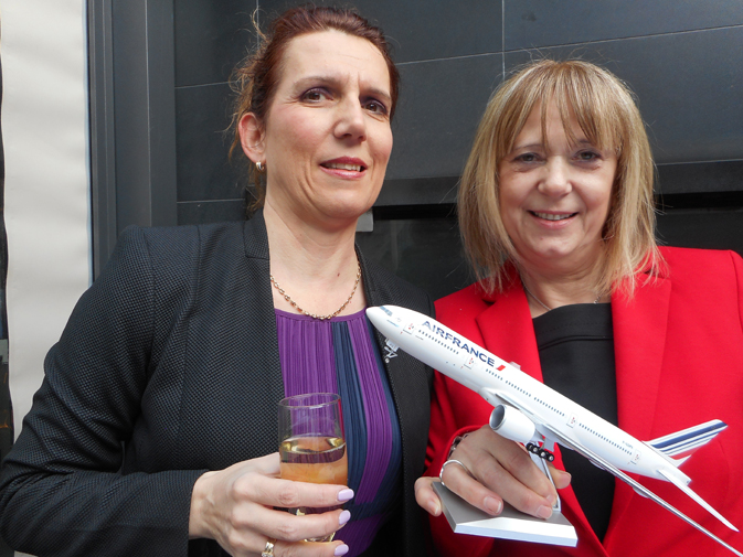 Travel consultant Zelma Demeter for Metro Travel Ltd. (left) and Victoria Boariu, Air France-KLM YVR supervisor enjoy at champagne toast at Air France's first year anniversary of the YVR to Paris route.