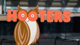 Hooters buys private island to build resort, plans Hooters Air