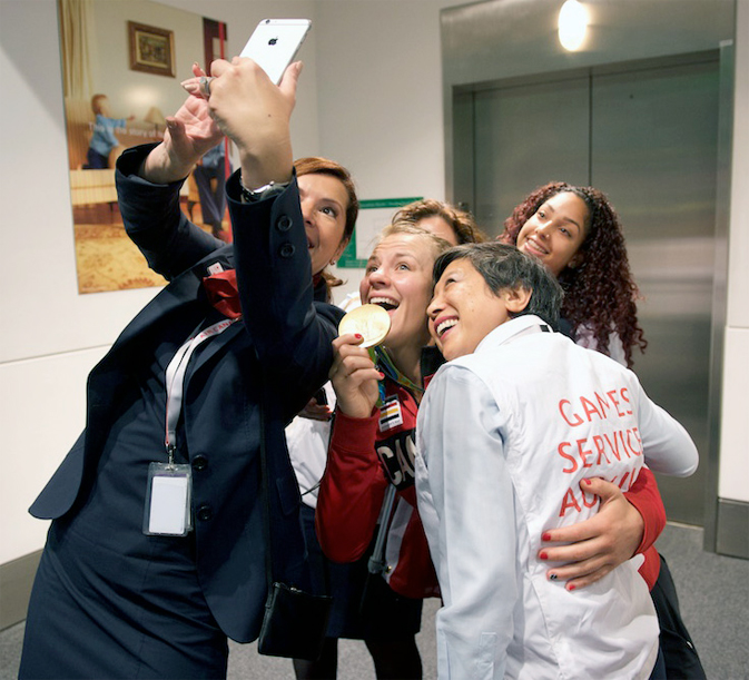 Air Canada employees doing a selfie with Erica Wiebe, Gold medalist in Women's 75 kg Wrestling
