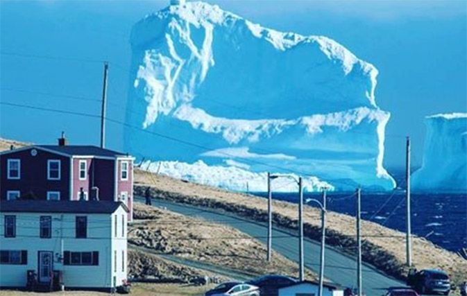 Newfoundland town wakes up to find giant iceberg off its shores