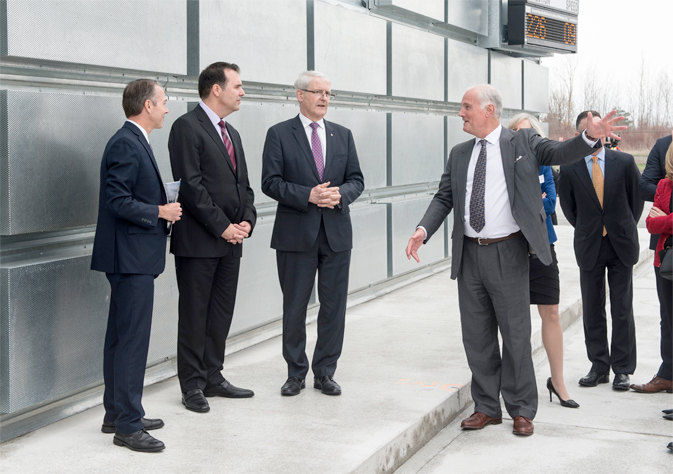 The Honourable Marc Garneau, Minister of Transport joins PortsToronto CEO Geoffrey Wilson and Gene Cabral, Executive Vice President of Billy Bishop Toronto City Airport on a tour of the new Ground Run-Up Enclosure.