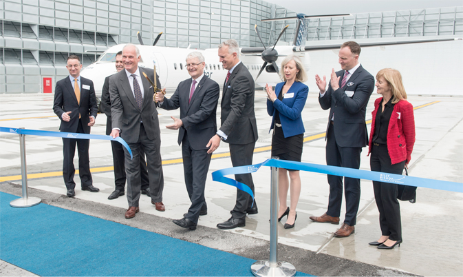 he Honourable Marc Garneau, Minister of Transport joins PortsToronto CEO Geoffrey Wilson and PortsToronto Chair Robert Poirier to cut the ribbon to officially open the new Ground Run-Up Enclosure at Billy Bishop Toronto City Airport.