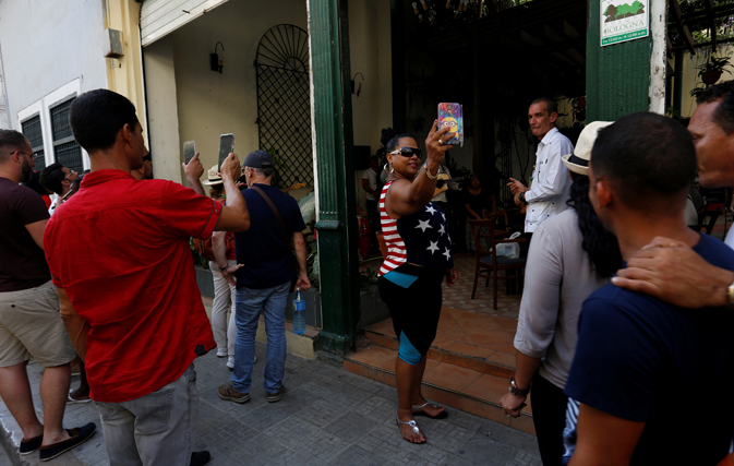 Tourists take pictures in Havana, Cuba