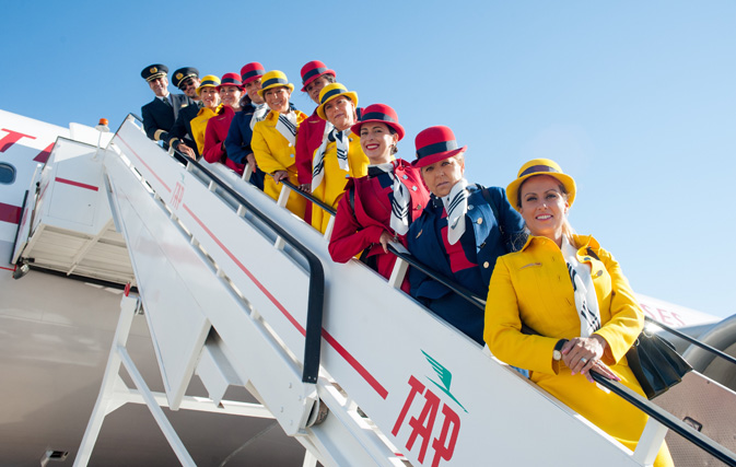 Flight crew and cabin crew onboard TAP's retro jet