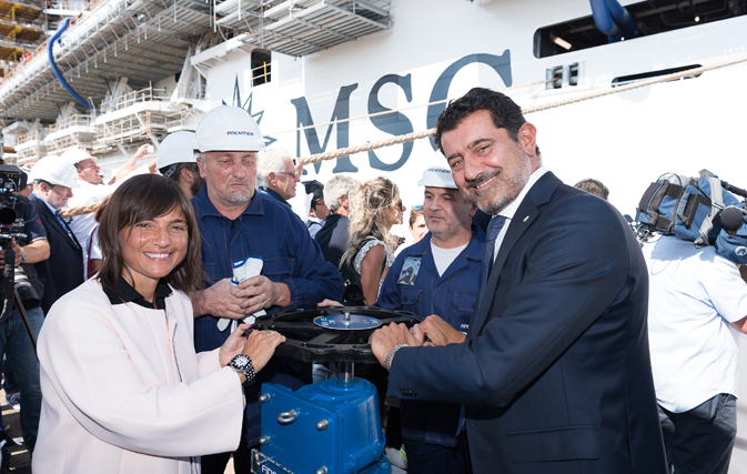 Gianni Onorato and Debora Serracchiani open the valves at the float out ceremony of MSC Seaview