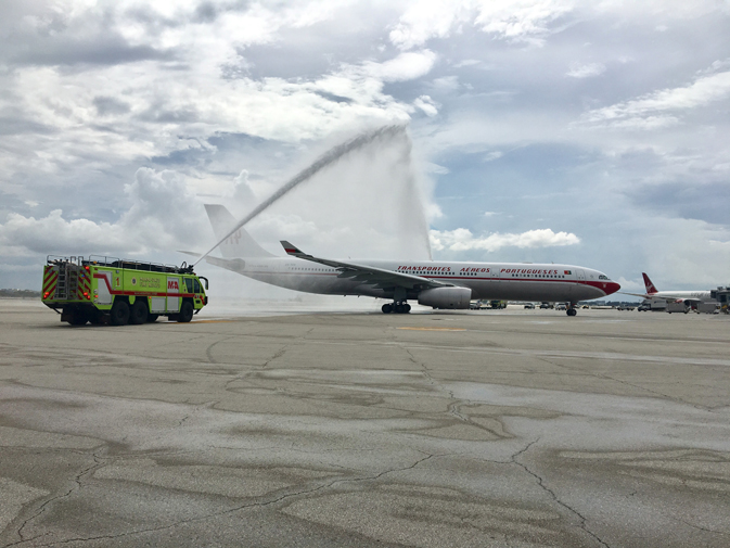 The retro flight landed at Miami International Airport with a celebratory water salute.