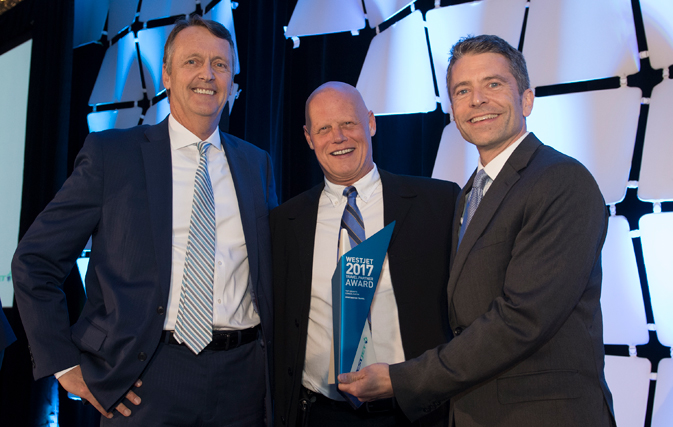 Lyell Farquharson (Vice President, Sales and Distribution) and Robert Dungan (Director, Business Development) with the winner of Top Growth Consolidator, Huntington Travel (CNW Group:WestJet)