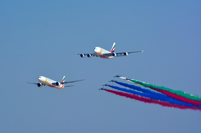 Emirates Boeing 777 and Airbus A380 open Dubai Airshow flying display in spectacular fly past with Al Fursan