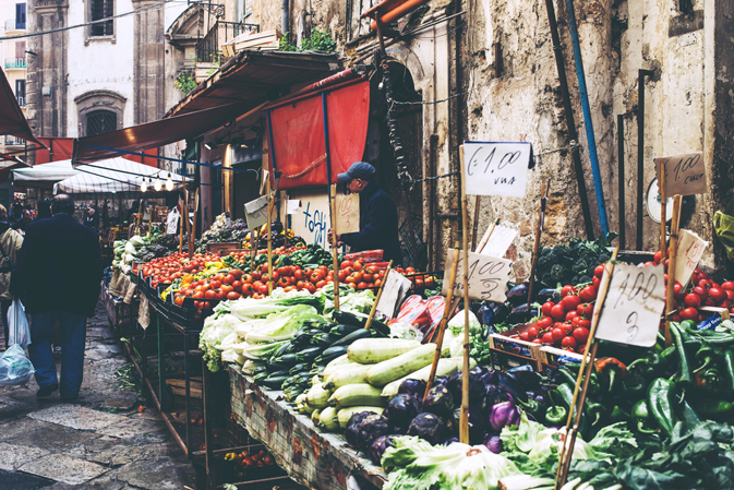 Grocery shop at famous local market Ballaro in Palermo, Italy.