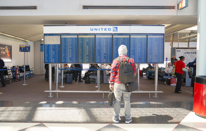 U.S. airlines bump fewer passengers off oversold flights