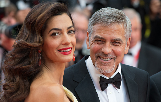 George Clooney boards flight with babies, hands out headphones to fellow passengers