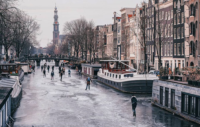 Amsterdam is so chill that people are now skating on its frozen canals