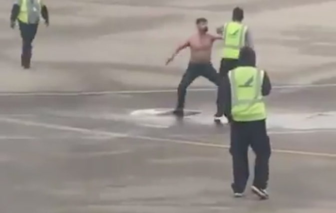 Caught on video: Drunk passenger throwing it down on airport tarmac