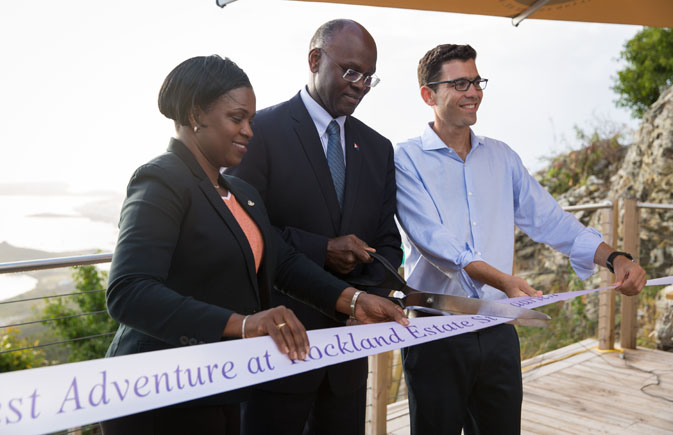 Prime Minister Leona Romeo-Marlin, Governor Dr. Eugene Holiday, Rainforest Adventures president Josef Preschel (left to right) taking part in a ribbon cutting ceremony to mark the official grand opening of the Rockland Estate eco-park attraction in St. Maarten.