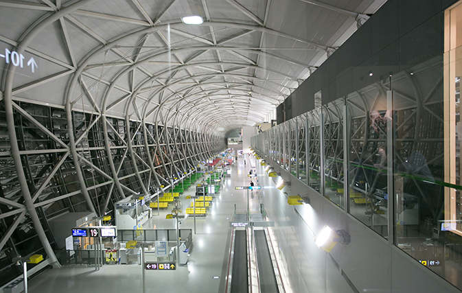 Storm hit Japan airport counts damage; unclear when reopens