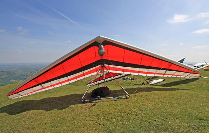 Watch a hang glider hang on for dear life while on vacation in Switzerland