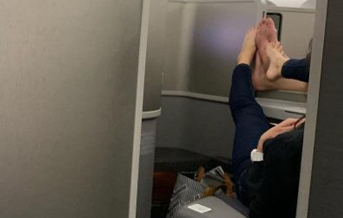 Couple caught playing footsies – with bare feet – in first class