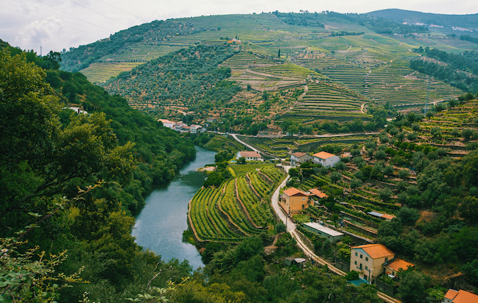 Cruise ship arrives to Porto by the river Douro